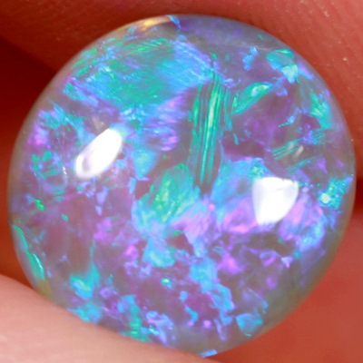 SOLID CRYSTAL OPAL Blue fire in a very 3 dimensional play of colour. Bright, clean colours. With VIDEO